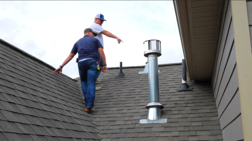 Turn Key Roofing: Upstate SC: Annual Maintenance Contract Two members of Turn Key Roofing inspecting residential roof.