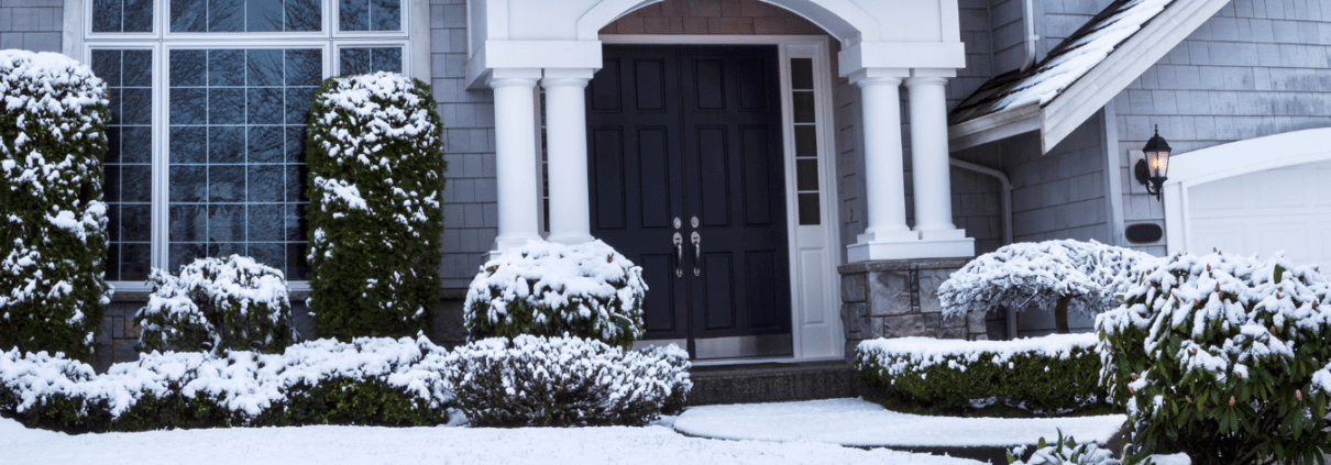 15 Beautiful two story residential home covered in snow.