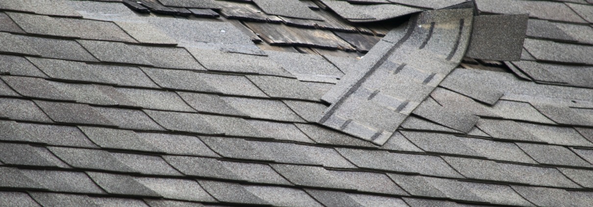 iStock 545656284 A badly damaged roof with missing shingles in need of repair