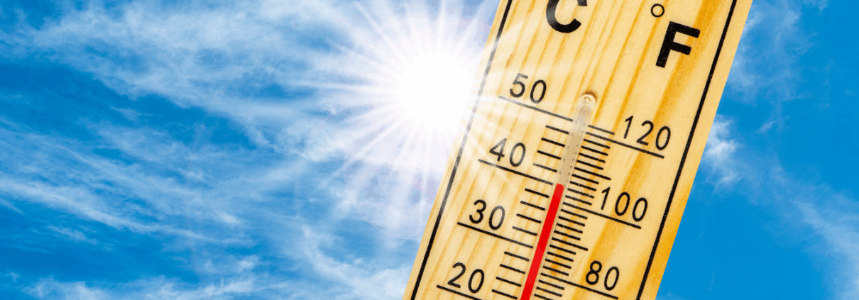 How South Carolinas Heat Wave Is Impacting Your Roof Thermometer with high temperature in front of sun/sky.