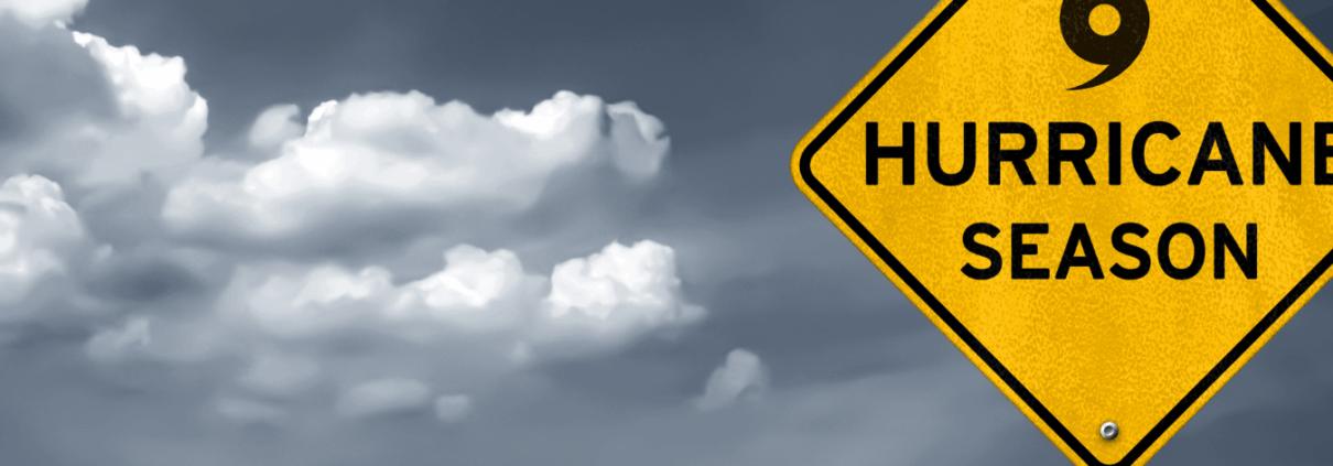 Turn Key Why Routine Roof Inspections Are Essential After Extreme Weather Events Dark, stormy sky, with sign that says "hurricane season".
