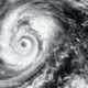 Eye of a hurricane viewed from above the clouds